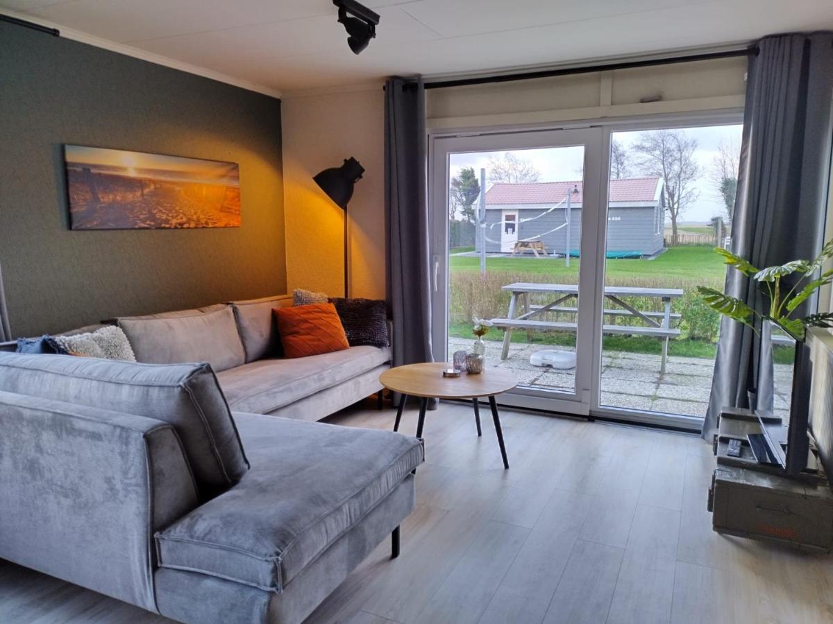 Het Dobbertje, charmant houten huisje Sint Maartensvlotbrug Buitenkant foto
